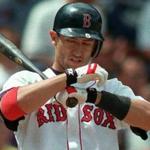 7-26-98:Boston:Red Sox shortstop Nomar Garciaparra is almost as well known for his systematic ways of doing things on the baseball field as he is for his prowess with the bat or his glove. Here he adjusts his batting gloves between pitches, something he does every at bat.